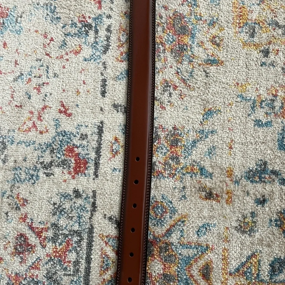 Beautiful brown belt with silver buckle. New, never worn.